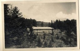 View of Solahütte, an SS retreat near Auschwitz.
From Karl Höcker's photograph album, which includes both documentation of official visits and ceremonies at Auschwitz as well as more personal photographs depicting the many social activities that he and other members of the Auschwitz camp staff enjoyed. These rare images show Nazis singing, hunting, and even trimming a Christmas tree. They provide a chilling contrast to the photographs of thousands of Hungarian Jews deported to Auschwitz at the same time. 