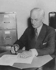 Four days after the outbreak of World War II, Secretary of State Cordell Hull signs the Neutrality Proclamation (first signed by President Franklin D. Roosevelt) at the State Department. Washington, DC, United States, September 5, 1939.