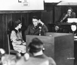 Fifteen-year-old Marie Doležalová testifies for the prosecution at the RuSHA Trial. She was one of the children kidnapped by the Germans after they destroyed the town of Lidice, Czechoslovakia, in June 1942. Nuremberg, Germany, October 30, 1947.