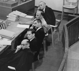 The prosecution team, including chief prosecutor and attorney general Gideon Hausner (bottom left), during Adolf Eichmann's trial. [LCID: 65273]