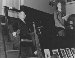 <p>Rufus Jones (seated) and Clarence Pickett were chairman and executive secretary of the <a href="/narrative/4339">American Friends Service Committee</a> (AFSC), respectively. They are pictured here at a Quaker meeting in Philadelphia. The AFSC assisted Jewish and Christian European refugees. Philadelphia, United States, January 22, 1943.</p>