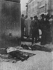 The bodies of SS General Reinhard Heydrich's assassins and five other operatives were displayed in front of the Carlo Boromeo Church (now the St. Cyril and Methodius Church).
On May 27, 1942, two Czech parachute agents (Jan Kubis and Josef Gabcik) succeeded in rolling a hand grenade under Heydrich's vehicle. Heydrich later died from his wounds. Kubis and Gabcik went into hiding, joining with five other operatives in the Carlo Boromeo Church in Prague. On June 18, however, Nazi authorities became aware of their whereabouts and surrounded the church. All seven of the resisters were either killed in the fighting or committed suicide. Their bodies were removed from the crypt and placed on display in front of the church. Prague, Czechoslovakia, June 1942.