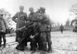 <p>An African American soldier is among those members of the Soviet and US armed forces posing here upon the historic meeting of the two armies on the Elbe River. Torgau, Germany, April 26, 1945.</p>