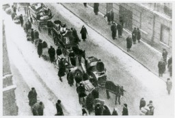 Jews forced to move into the Lodz ghetto. Lodz, Poland, date uncertain. [LCID: 50345]