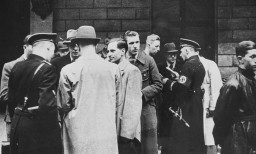 SS and Nazi police prepare for a raid on the Jewish community offices in Vienna. [LCID: 65636a]