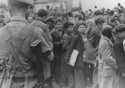 British soldiers transfer children refugees from the Aliyah Bet ("illegal" immigration) ship "Theodor Herzl" to a vessel for deportation to Cyprus detention camps. Haifa port, Palestine, April 24, 1947.