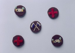 Boy Scout handmade badges worn by German-Jewish refugee boys. British expatriates had transplanted the Boy Scouts to Shanghai before the refugees' arrival. Unlike most of the Polish Jewish refugees, German and Austrian Jews usually went to Shanghai as families, and enrollment in schools and youth organizations in the International Settlement grew rapidly. [From the USHMM special exhibition Flight and Rescue.]