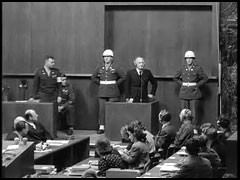 Defendant Julius Streicher is sworn in as a witness during the International Military Tribunal at Nuremberg.