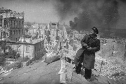 Soviet photographer Yevgeny Khaldei views the destruction of Budapest from a rooftop. Budapest, Hungary, February 1945. 