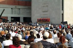 View of a ceremony held during the Museum's Tribute to Holocaust Survivors: Reunion of a Special Family, one of the United States Holocaust Museum's tenth anniversary events. Flags of the liberating divisions form the backdrop to the ceremony. Washington, DC, November 2003.