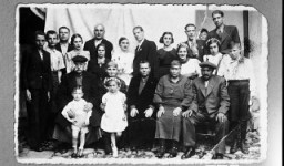Portrait of the family of Bohor Kalderon.
This photograph was one of the individual and family portraits of members of the Jewish community of Bitola, Macedonia, used by Bulgarian occupation authorities to register the Jewish population prior to its deportation in March 1943.