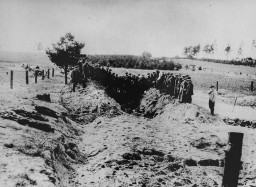 Unearthing the evidence of Nazi crimes in Kovno; Soviet officers preside over the opening and exhumation of a mass grave at  the ... [LCID: 81144]