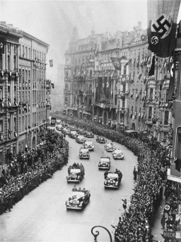 Scene during Adolf Hitler's triumphant return to Berlin shortly after Germany's annexation of Austria (the Anschluss). [LCID: 83134]
