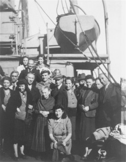 Austrian and German Jewish displaced persons (DPs)—who had survived the war in Albania—pose aboard a British ship taking them to the Tricase DP camp in Italy, September 28, 1945.  