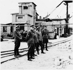Commandant Arthur Roedl (center) and SS officers visit the Gross-Rosen concentration camp's quarry. Gross-Rosen, Germany, 1941.