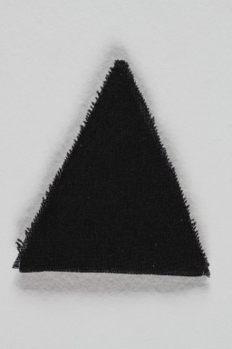 Unused black triangle concentration camp badge