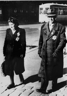 A Jewish couple wearing mandatory Jewish badges. Germany, September 27, 1941. [LCID: 55170]