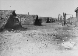 A view of barracks in the Kaufering network of subsidiary camps of the Dachau concentration camp. Landsberg-Kaufering, Germany, after April 27, 1945.