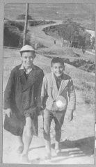 Portrait of two schoolchildren: Solomon Faradji, son of Avram Faradji, and Sami Levi, son of Rafael Levi. Solomon lived at Karagoryeva 113, and Sami lived at Karagoryeva 105, in Bitola.
This photograph was one of the individual and family portraits of members of the Jewish community of Bitola, Macedonia, used by Bulgarian occupation authorities to register the Jewish population prior to its deportation in March 1943.