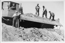Jewish forced laborers at Tempelhof in Berlin. Three of the four were later deported. [LCID: 61835]