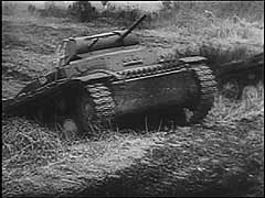 Germany invaded France in May 1940. This footage shows German tanks, artillery, and divebombers attacking the Maginot Line, a series of French fortifications intended to protect France's border with Germany. The main German assault, however, went to the north through Luxembourg and bypassed the Maginot Line. German forces entered Paris on June 14, 1940. Little more than a week later, defeated France signed an armistice with Germany.