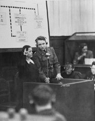 A Czech woman who witnessed the Nazi massacre of the male inhabitants of Lidice is sworn in at the RuSHA trial in Nuremberg, case #8 of the Subsequent Nuremberg Proceedings. Germany, October 30, 1947.