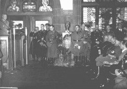 Nazi officials and Catholic bishops listen to a speech by Wilhelm Frick, Reich Minister of the Interior, at an official ceremony in the Saarbrucken city hall marking the reincorporation of the Saarland into the German Reich. March 1, 1935.
Among those pictured is Joseph Goebbels (seated at the far right), Franz Rudolf Bornewasser (Bishop of Trier) and Ludwig Sebastian (Bishop of Speyer).