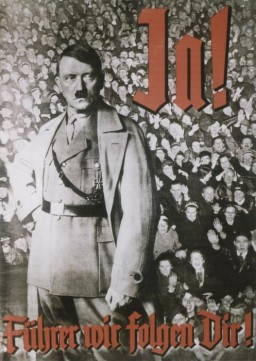 Nazi propaganda constantly reinforced the notion that Hitler was the embodiment of the national will. Here, a determined looking Hitler in military dress stands with clenched fist, poised for action above the adoring crowd. The text on the poster says "Yes! Leader, We Follow You!" (Ja! Führer wir folgen Dir!)
This poster, designed for a 1934 public referendum on uniting the posts of German chancellor and president, conveys unanimous popular support for Hitler.