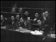 This film clip shows translators in action at the Nuremberg trial. English, French, Russian, and German were the official languages of the Nuremberg trials. Interpreters provided simultaneous translations of the court proceedings which were then available to the trial participants via headphones.