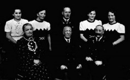 The Greinegger family, shown here in a formal portrait, were prosperous farmers in northern Austria. During World War II, the son died as a soldier in the German army. The second youngest daughter, Frieda, spent almost two years in Ravensbrück concentration camp for consorting with a Polish forced laborer, Julian Noga. Frieda and Julian married after the war. Place and date of photograph uncertain.