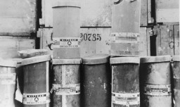Containers of Zyklon B poison gas pellets found at the Majdanek camp after liberation. [LCID: 50571]