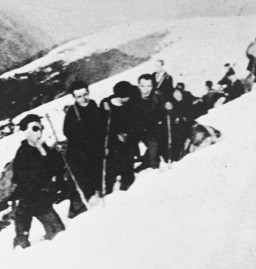 Jewish refugees from France and the Netherlands make their way from France into Spain through a pass in the Pyrenees mountain range. [LCID: 90667]