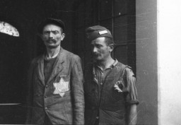 Two men standing in a doorway in the former Budapest ghetto