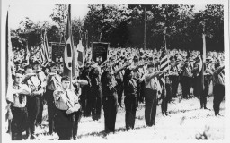 Members of the pro-Nazi German American Bund and the pro-Fascist Italian Blackshirts give the Nazi salute. [LCID: 00579]