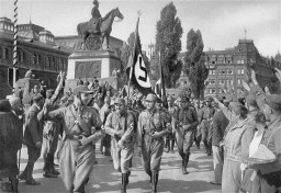 Horst Wessel leads his SA formation through the streets of Nuremberg during the fourth Nazi Party Congress in August 1929. 