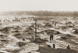 View of a camp for Soviet prisoners of war, showing the holes dug into the ground that served as shelter. [LCID: 01704]