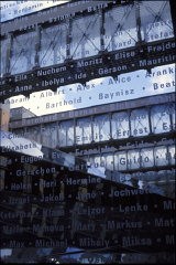 Detail of an interior bridge at the United States Holocaust Memorial Museum with the names of victims etched in glass. Washington, DC, 1996.