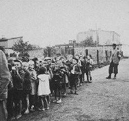 A group of children assembled for deportation to Chelmno. During the roundup known as the "Gehsperre" Aktion, the elderly, infirm, and children were rounded up for deportation. Lodz, Poland, September 5-12, 1942.