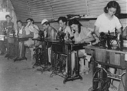 Jewish refugee youths, prevented by the British from landing in Palestine, learn sewing at a detention camp. The machines were provided by the American Jewish Joint Distribution Committee (JDC). Cyprus, 1947.