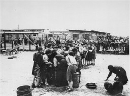 After liberation by US troops, former prisoners wait in line for soup. [LCID: 45035a]