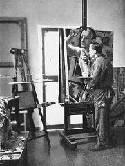 Georg Grosz, a Communist satirical artist and painter, seen here in his studio in Berlin. He fled Germany shortly before the Nazi rise to power in 1933 and was one of the first to be stripped of his German citizenship by the Nazis. Berlin, Germany, 1929.