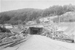 View of a tunnel entrance to the rocket factory at the Dora-Mittelbau concentration camp, near Nordhausen. [LCID: 01276]