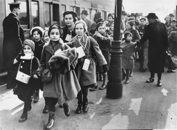 Austrian Jewish refugee children, members of one of the Children's Transports (Kindertransporte), arrive at a London train station. [LCID: 76606]