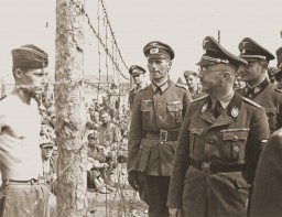 SS chief Heinrich Himmler (front, right) inspects a camp for Soviet prisoners of war. [LCID: 73457]