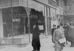 Jewish-owned shop destroyed during Kristallnacht (the "Night of Broken Glass"). [LCID: 50378]