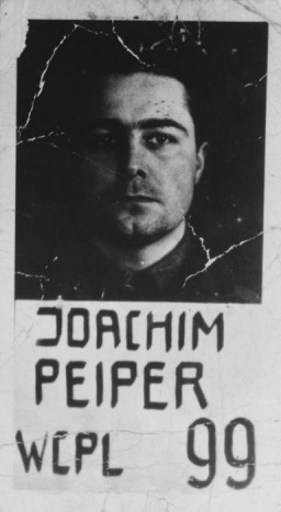 Mugshot of Colonel Joachim Peiper, defendant in the Malmedy atrocity trial. He was sentenced to death by hanging. Photograph taken ca. 1946. 