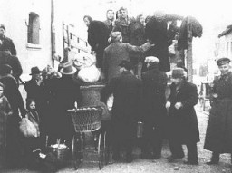 Bulgarian authorities round up Jews in occupied Macedonia for deportation. They were first held in a camp in Skopje and then deported to the Treblinka killing center in German-occupied Poland. Skopje, Yugoslavia, March 1943.