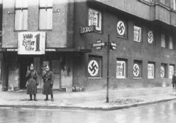 Policemen stand outside the shuttered Eldorado nightclub, long frequented by Berlin's gay and lesbian community. The Nazi government quickly closed the establishment down and pasted pro-Nazi election posters on the building. Berlin, Germany, March 5, 1933.
Learn more about this photograph.