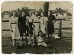 Group portrait of women and children standing outside in Warsaw before the war. Warsaw, Poland, ca. 1938. 