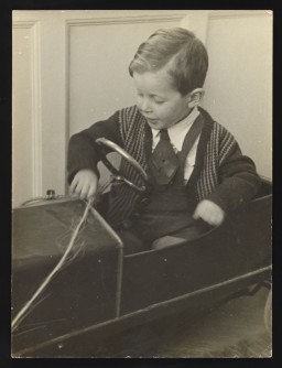 Photograph of a young Gideon Frieder playing with toys